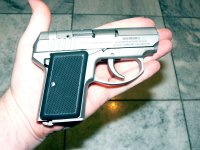 AMT .380 DAO size in palm.jpg