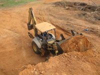 17  View of my backhoe loading dirt from the top of the dirt pile.jpg