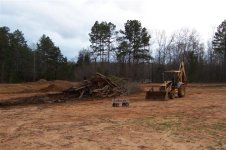 34  Burn pile after I pulled it apart, cut the logs, and stacked them.jpg